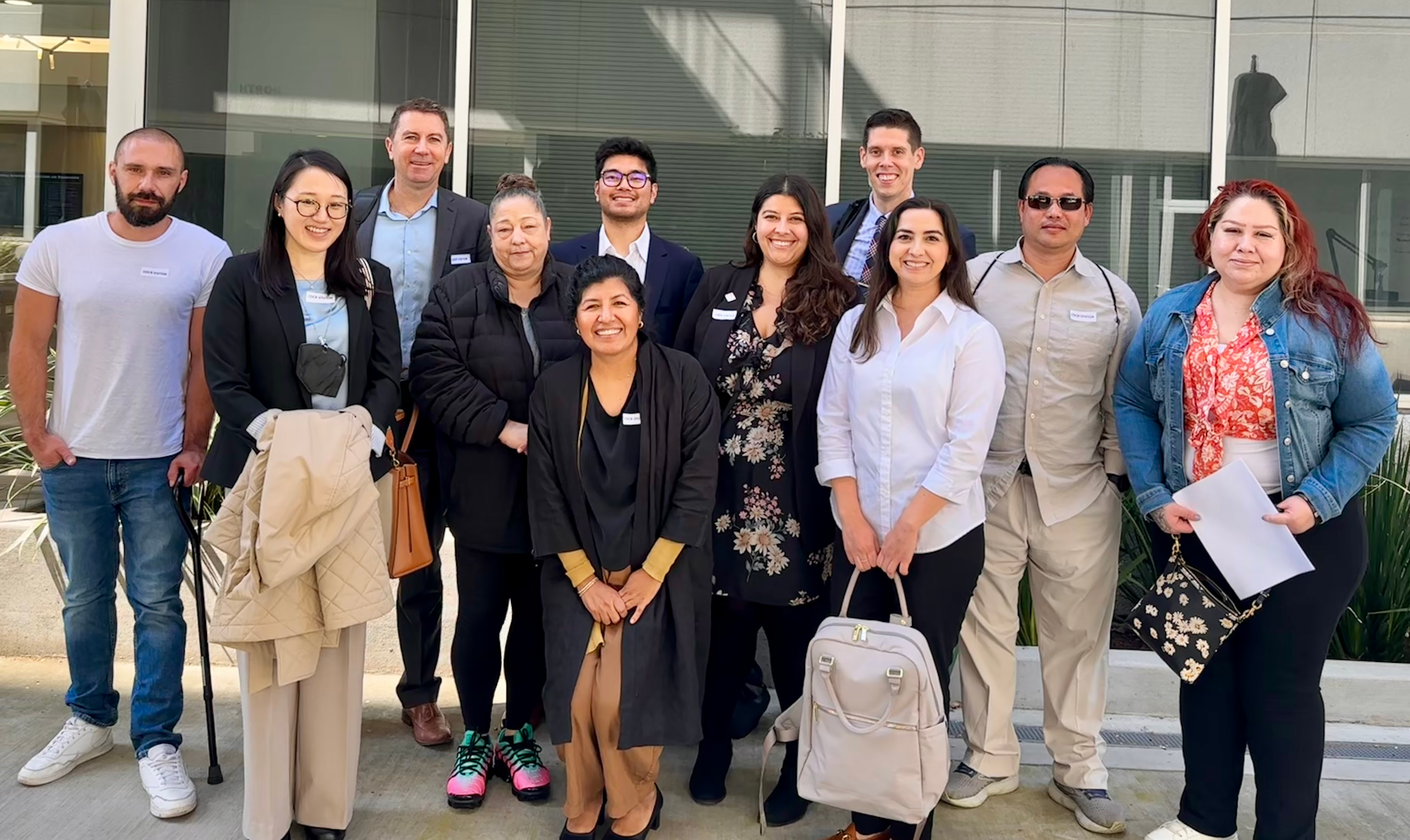Photo of a dozen people outside of the CDCR building.